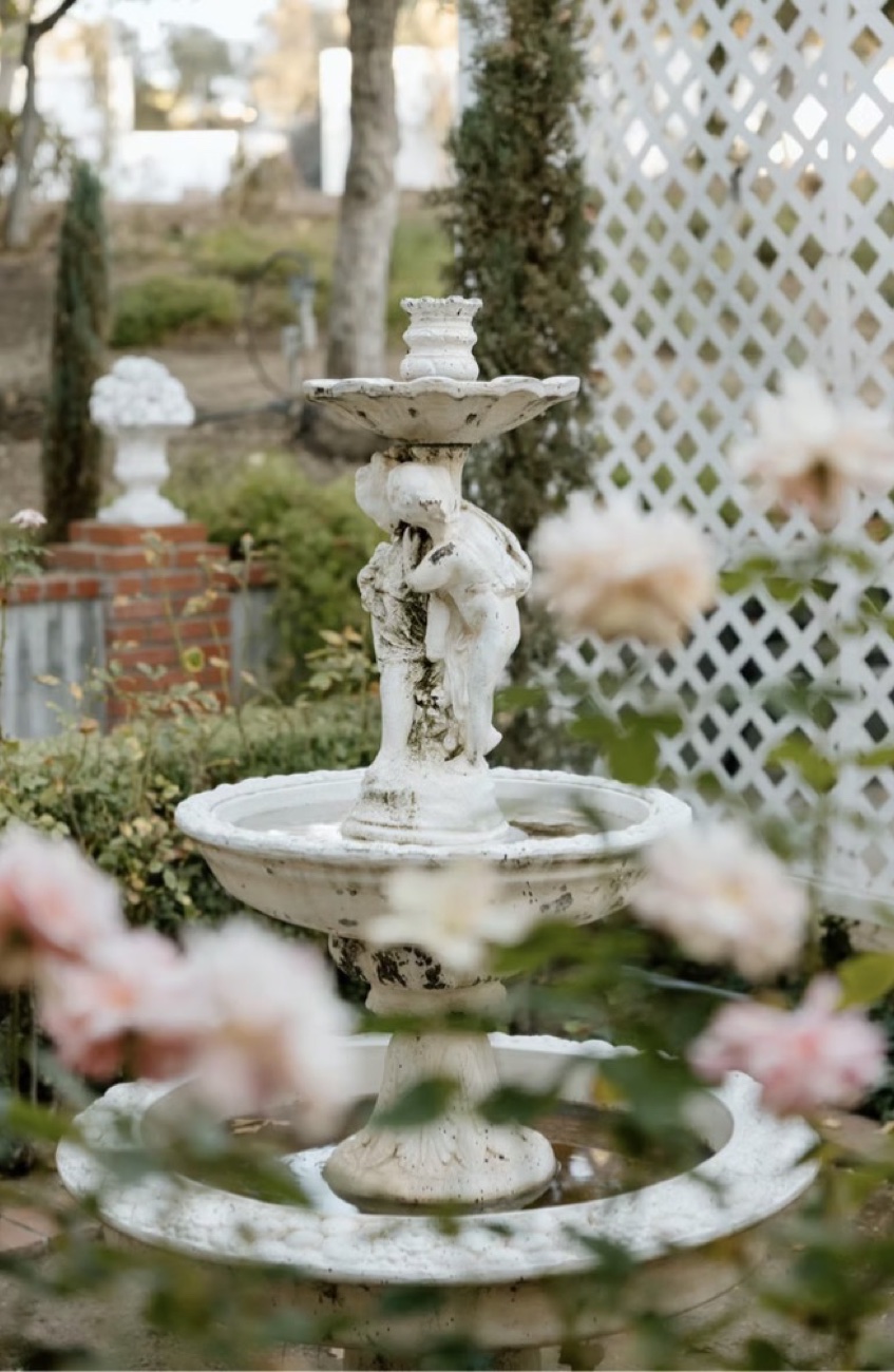 Thatcher Manor — cherub fountain in the rose garden